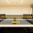 Modern conference room with a long meeting table and chairs, overlaid with the text “The Power of a Campus Workspace: Why Experiences Are Better When Shared” and a “Read More” button with BHIVE branding.