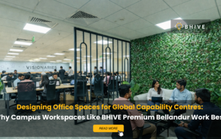 Busy coworking office at BHIVE Premium Bellandur campus showing professionals working at desks and collaborating in lounge area, representing an ideal workspace for Global Capability Centres.
